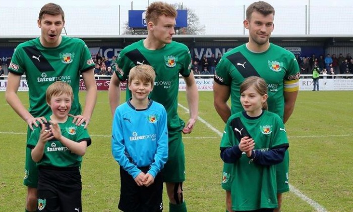 lucky charm mascot emily bevan, right, with team