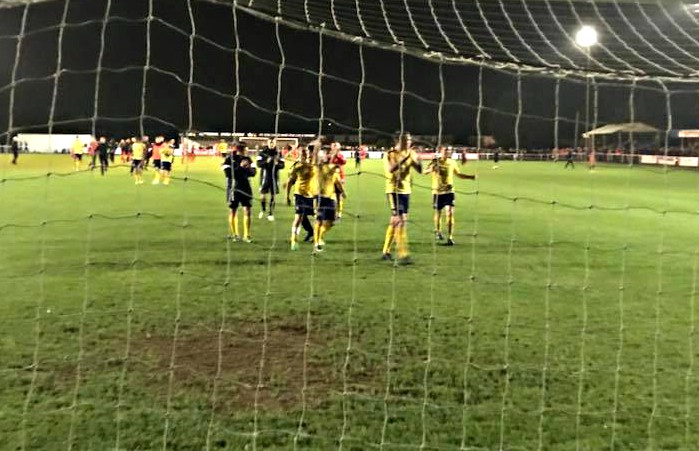 nantwich town players celebrate FA cup replay win at Kettering