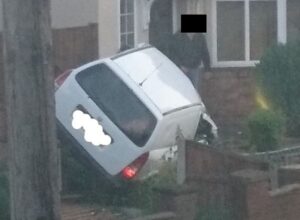 Vehicle fire after white van crashes into Nantwich front garden